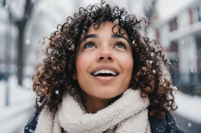 Joyful Woman in First Snowfall Close-Up