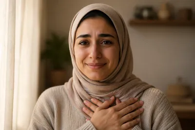 Grateful Young Woman with Hands on Heart