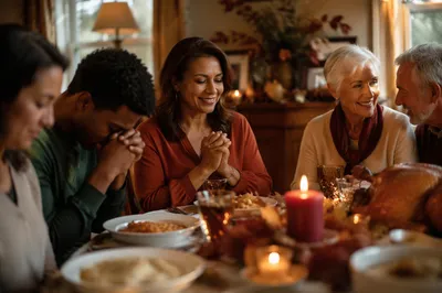 Family Giving Thanks Around Dinner Table