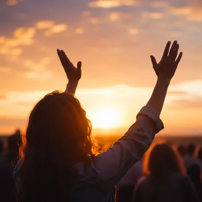 Raised Hands in Golden Sunset Praise