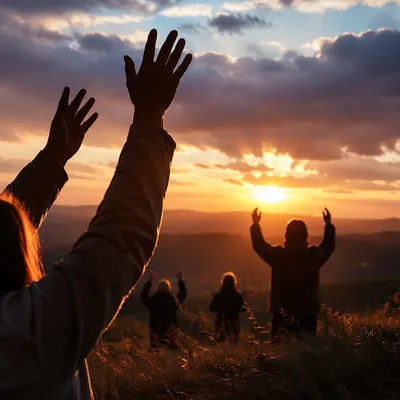 Praise Hands Raised Under Golden Sunset