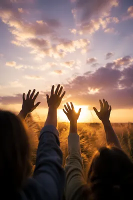 Praise Hands Lifted Under Golden Sunset
