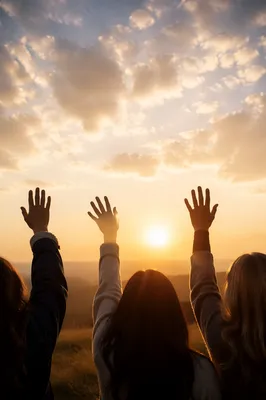 Lifted Hands Under Golden Sunset Sky
