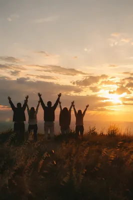 Praise Hands Lifted at Golden Sunset