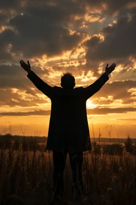Praise Hands Raised Under Golden Sunset