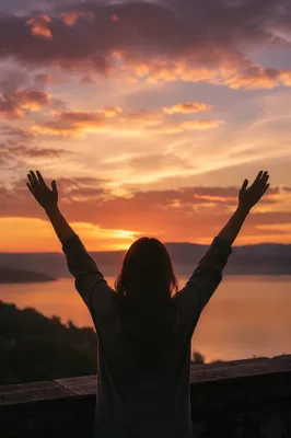 Praise Hands Raised at Golden Sunset