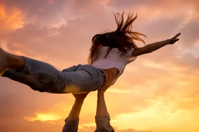 Joyful Praise Lifted Beneath Golden Sunset Sky