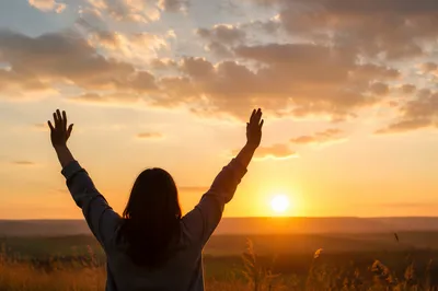 Praise Hands Raised at Golden Sunset
