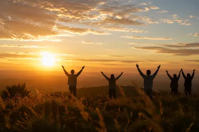 Praise Hands Raised at Golden Sunset