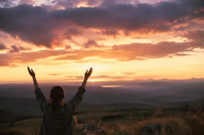 Silhouetted Praise Hands at Golden Sunset