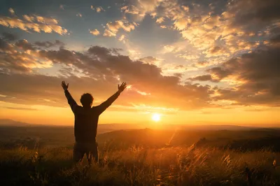 Praise Hands Lifted at Golden Sunset