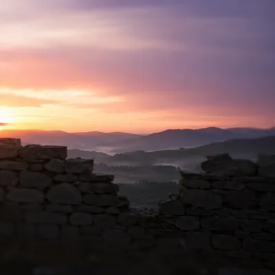 Redemption Sunrise Beyond a Broken Stone Wall