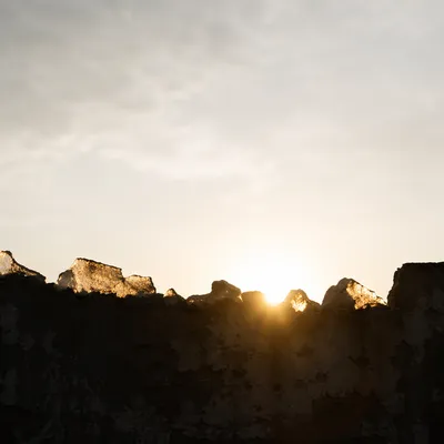 Redemption Sunrise Over Broken Masonry Wall