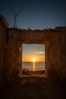 Redemption Sunrise Through a Broken Wall