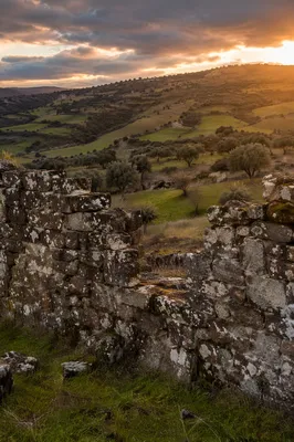 Redemption Sunrise Beyond a Broken Stone Wall