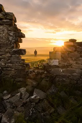 Redemption Sunrise Beyond a Broken Stone Wall