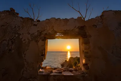 Redemption Sunrise Through Broken Wall
