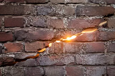 Redemption Sunrise Through a Broken Brick Wall