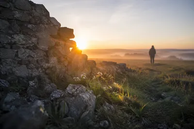 Redemption Sunrise Through Broken Stone Wall