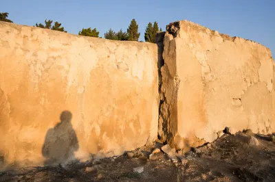 Redemption Sunrise Over a Broken Wall