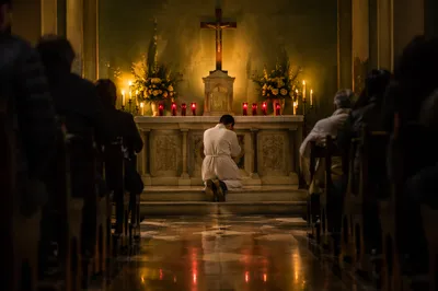 Repentant Prayer at Church Altar Cross