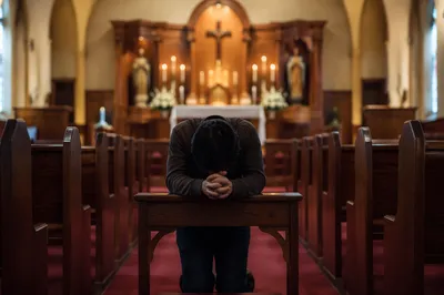 Repentant Prayer at Church Altar