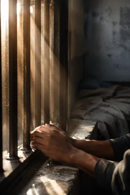 Hopeful Morning Light Through Prison Bars