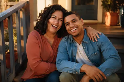 Adult Siblings Laughing on Front Steps