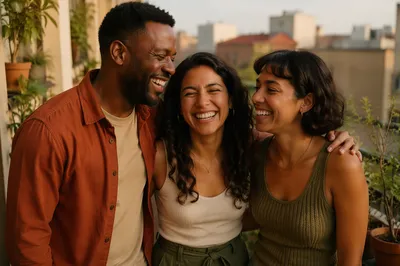 Three Adult Siblings Laughing on Balcony
