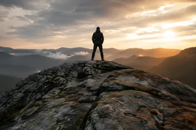 Silhouette on Mountain Rock at Dawn