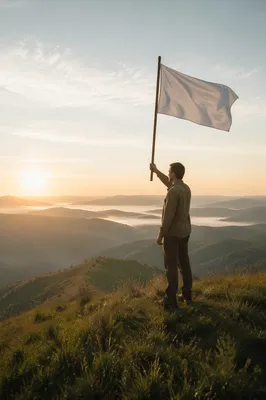 Person Raising White Flag at Sunrise