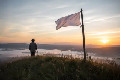 White Flag of Surrender at Sunrise