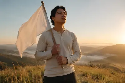 Man Holding White Flag at Sunrise