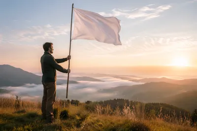 Solitary Figure Raising White Flag at Sunrise