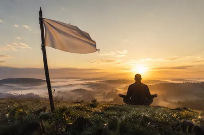 White Surrender Flag at Hopeful Sunrise