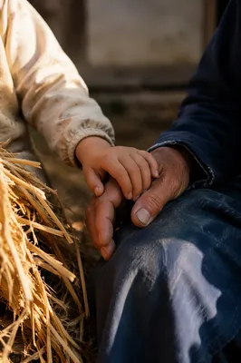 Child Holding Adult Hand in Trust