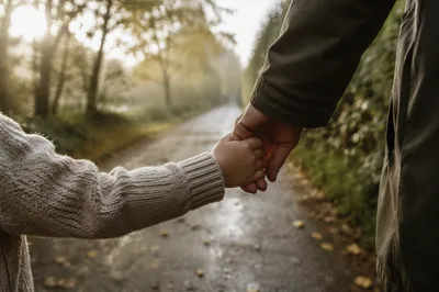 Child Holding Adult Hand in Trust
