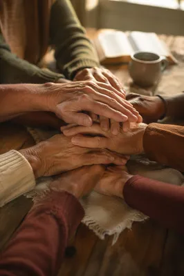 Many Hands United in Prayer
