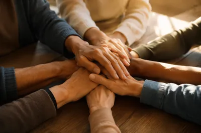 Diverse Hands Stacked in Warm Unity