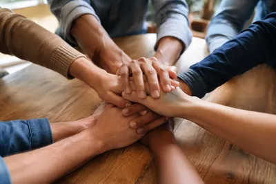Diverse Hands Stacked in Quiet Unity