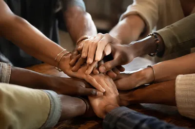 Diverse Hands Stacked in Unity Circle