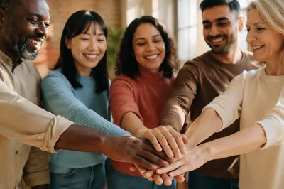 Diverse Coworkers Stacking Hands in Unity