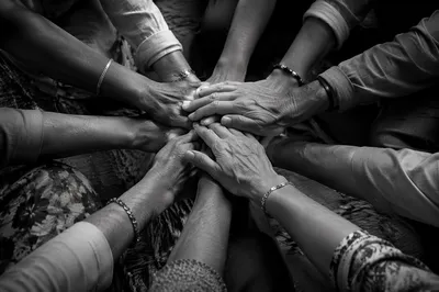 Many Hands United in Faithful Encouragement