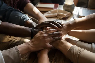 Diverse Hands Joined in Prayerful Unity