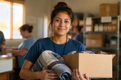 Young Woman Holding Donations Indoors