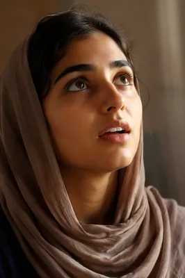 Awestruck Young Woman Looking Up Close-Up