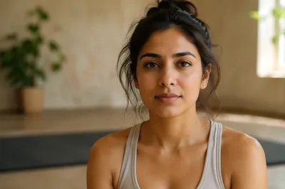 Calm South Asian Woman in Yoga Studio