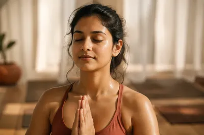 Calm Woman Meditating in Sunlit Studio