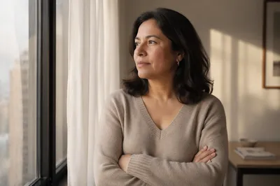 Thoughtful Woman by Apartment Window