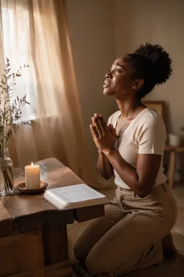 Young Woman Praying Beside Wooden Altar